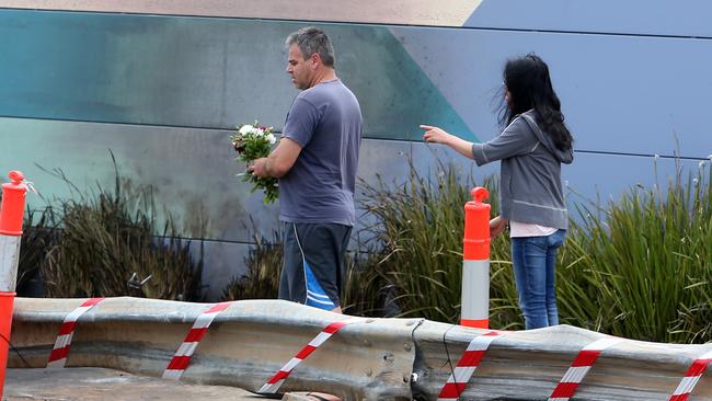 People laying flowers at the scene of the tragedy. Picture: Yuri Kouzmin