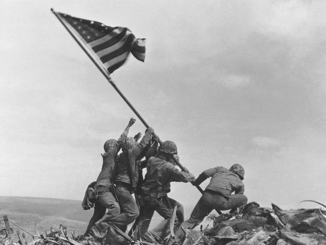 The 1945 flag raising at Iwo Jima by the AP’s Joe Rosenthal is included in Time magazine's most influential images of all time. Picture: AP Photo/Joe Rosenthal, File