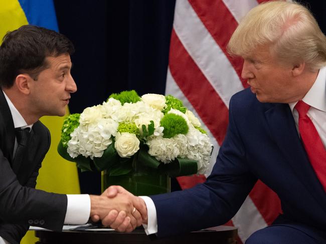 TOPSHOT - US President Donald Trump and Ukrainian President Volodymyr Zelensky shake hands during a meeting in New York on September 25, 2019, on the sidelines of the United Nations General Assembly. (Photo by SAUL LOEB / AFP)