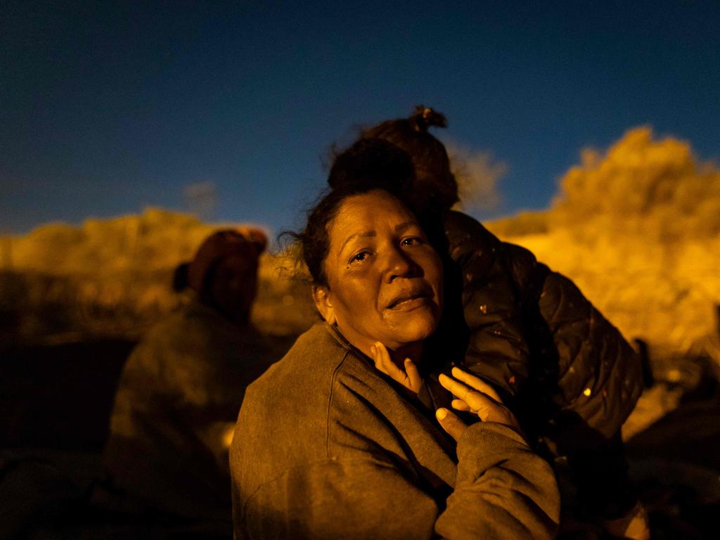 Sulan, a migrant from Venezuela, is comforted by her daughter as she cries while retelling her journey to reach El Paso, in Texas on April 2, 2024. Picture: AFP