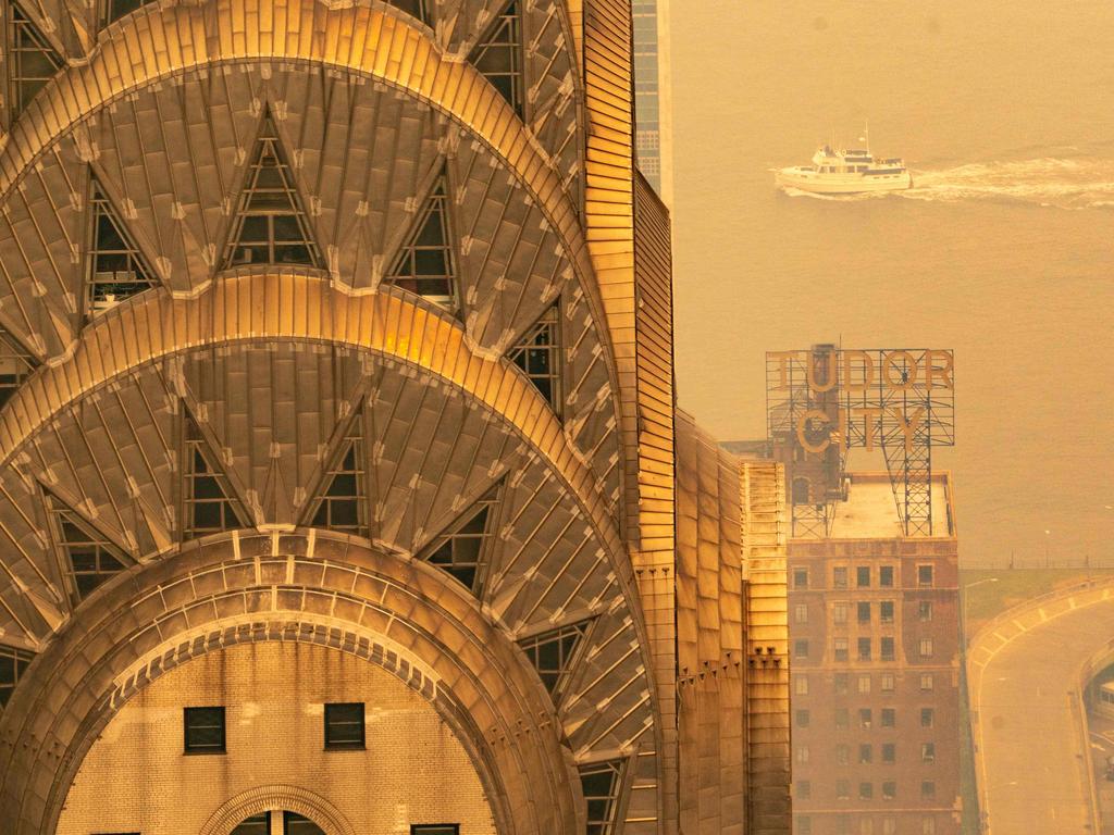 The iconic art deco Chrysler Building is covered in a thick smoky haze from wildfires in Canada as it blankets Manhattan in June. Picture: David Dee Delgado/Getty Images