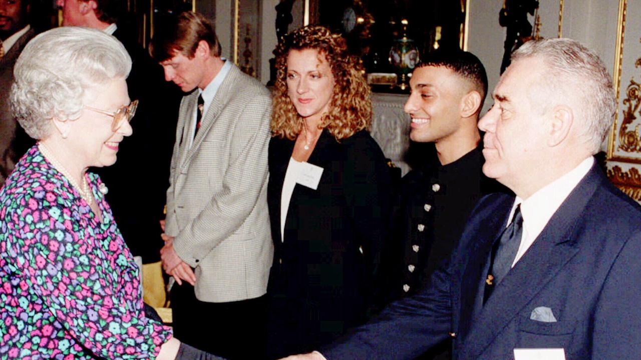 Queen Elizabeth II (far left)  meeting (l-r) soccer player Stuart Pearce, athlete Sally Gunnell, boxer Prince Naseem and shaking hands with yachtsman Tony Bullimore rescued from capsized yacht in Southern Ocean.  british royalty