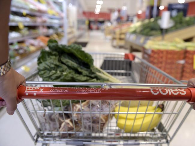 A customer pushes a shopping cart down an aisle at a Coles supermarket, operated by Wesfarmers Ltd., in the Richmond area of Melbourne, Australia, on Friday, Feb. 10, 2017. Wesfarmers, Australia's largest retailer, is scheduled to report fourth-quarter results on Feb. 15. Photographer: Carla Gottgens/Bloomberg