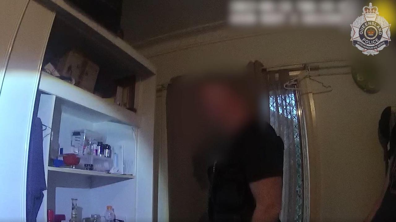 Police search a wardrobe at a property. Picture: Qld Police