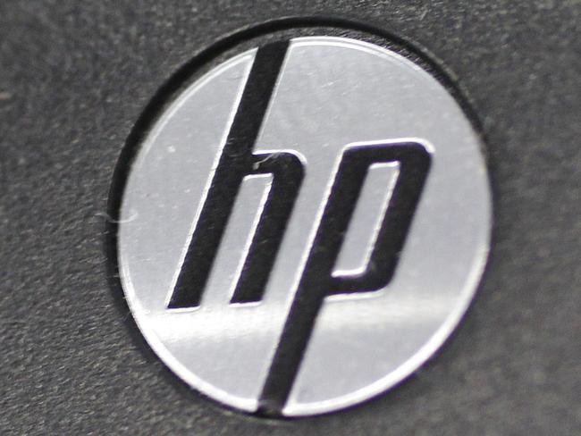 FILE - This Aug. 20, 2012, file photo shows the Hewlett-Packard logo on a keyboard at a Best Buy store in Mountain View, Calif. Hewlett-Packard reports quarterly earnings on Thursday, May 22, 2014. (AP Photo/Paul Sakuma)