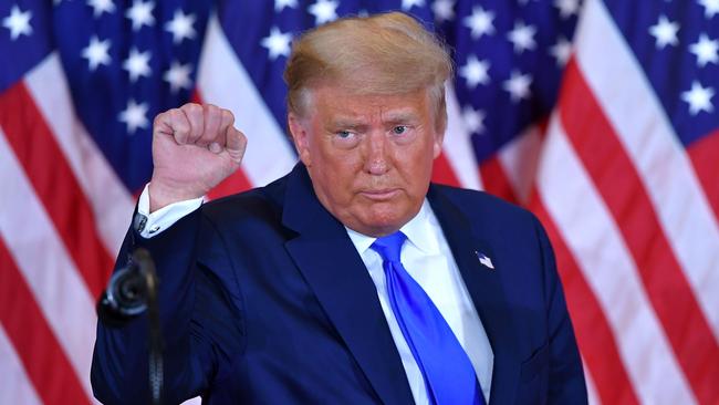 Donald Trump pumps his fist after delivering a speech on election night in the East Room of the White House in Washington, DC, on November 4. Picture: AFP