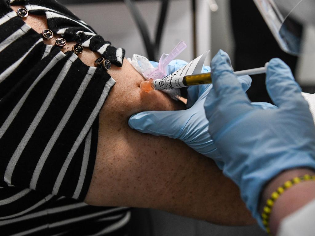 Sandra Rodriguez, 63, receives a COVID-19 vaccination test from Yaquelin De La Cruz at the Research Centres of America (RCA) in Hollywood, Florida. Picture: Handan Khanna/AFP