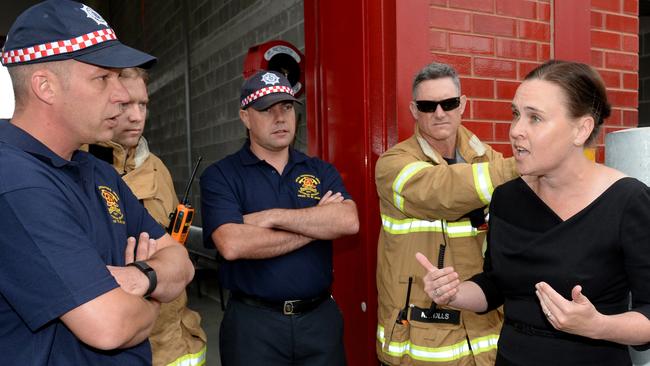 Former emergency services minister Jane Garrett is confronted by United Firefighters Union members. Picture: Kylie Else