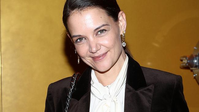 Katie Holmes and Bobby Wooten packed on the PDA. (Photo by Cindy Ord/Getty Images for NYFW: The Shows)