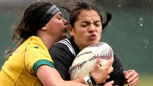 Millie Boyle of Australia tackles Portia Woodman of New Zealand.