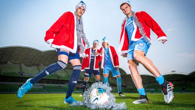 Anthony Lesiotis, Ben Carrigan, Harrison Delbridge and Josh Brillante ham it up for the cameras ahead of the Melbourne City vs Melbourne Victory Christmas Derby. Picture: Jake Nowakowski