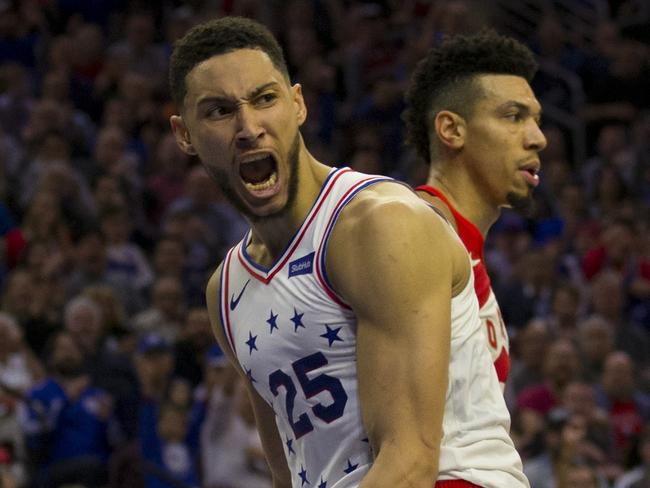 PHILADELPHIA, PA - MAY 09: Ben Simmons #25 of the Philadelphia 76ers reacts in front of Danny Green #14 of the Toronto Raptors after dunking the ball in the third quarter of Game Six of the Eastern Conference Semifinals at the Wells Fargo Center on May 9, 2019 in Philadelphia, Pennsylvania. The 76ers defeated the Raptors 112-101. NOTE TO USER: User expressly acknowledges and agrees that, by downloading and or using this photograph, User is consenting to the terms and conditions of the Getty Images License Agreement.   Mitchell Leff/Getty Images/AFP == FOR NEWSPAPERS, INTERNET, TELCOS & TELEVISION USE ONLY ==