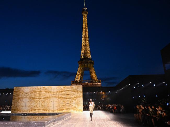 A model walks the runway in front of the Eiffel Tower during the Saint Laurent Womenswear Spring/Summer 2024 show as part of Paris Fashion Week. Picture: Stephane Cardinale/Getty Images