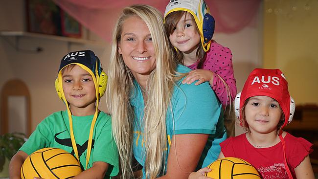 Jack, Alice and Sophia from Tigger's Honeypot Childcare Centre in Randwick with Aussie Stingers Water Polo player and Rio Olympian Lea Yanitsas. Picture: Danny Aarons.