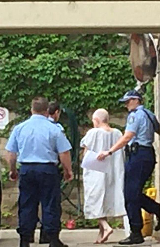 John Walsh is escorted from Maroubra police station after being charged with the murder of his Long Bay cell mate. Picture: Seven News