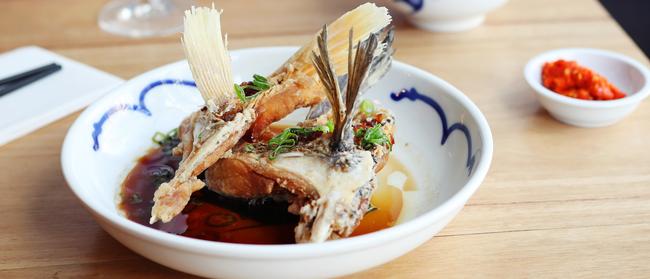 Frying high: the barramundi collars battered crisp are messy but delicious