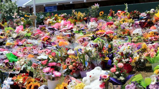 Floral tributes left on the front lawn of Dreamworld for the victims. Picture: Tim Marsden