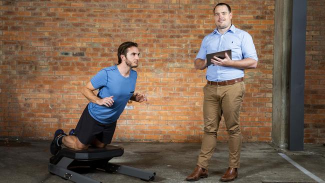 VALD Performance CEO Laurie Malone (right) and Michael Eggleton demonstrate the NordBord. Picture: AAP/Richard Walker