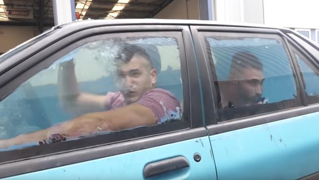 Youtubers RackaRacka head through the drive through at the Lonsdale Hotel in a car full to the brim with water. Source: Youtube