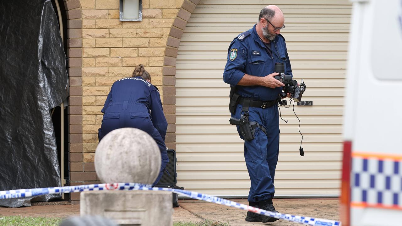 Police at the home. Picture: Adam Head