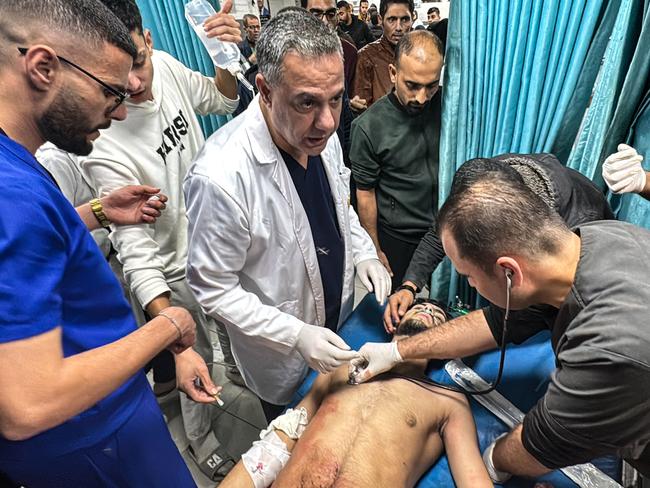 Hossam Abu Safieh, director of the Kamal Adwan Hospital, supervises the treatment of a Palestinian man, injured in an Israeli strike on Beit Lahia in the northern Gaza Strip. Picture: AFP