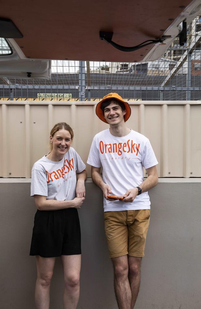 Orange Sky volunteers Laura Stokes and Oliver Wightman. Picture: Mark Cranitch.