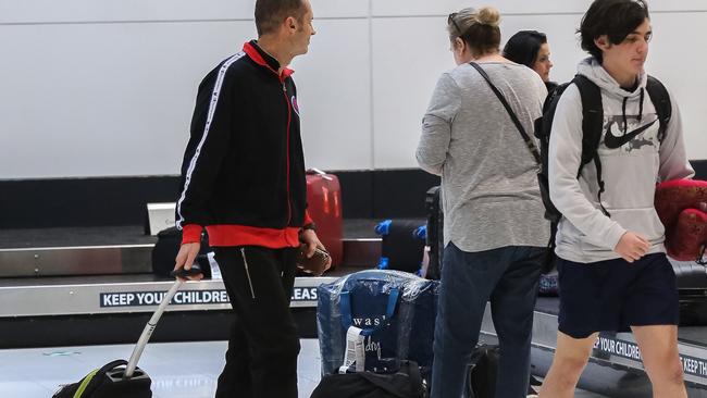 Passengers are pictured at Brisbane Domestic Airport as Jetstar and Virgin scheduling flights into Sunshine Coast and Cairns after borders begin to re-open in Queensland. Picture: NCA NewsWire / David Kapernick