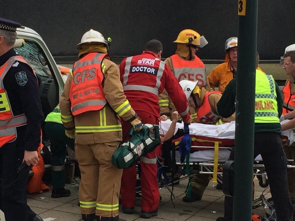 Paramedics with one of the crash victims. Picture: Sam Kelton