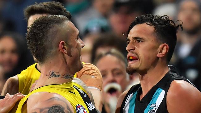 Sam Powell-Pepper stands up to Richmond idol Dustin Martin at Adelaide Oval on Saturday. Picture: Daniel Kalisz/Getty Images