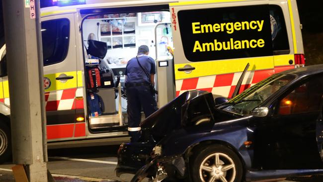 A male has has been arrested after crashing his Holden Commodore into a light pole on Bennelong Road, Wentworth Point. Picture: Bill Hearne