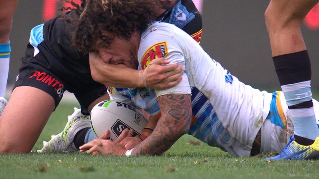 Kevin Proctor bites the arm of Shaun Johnson.