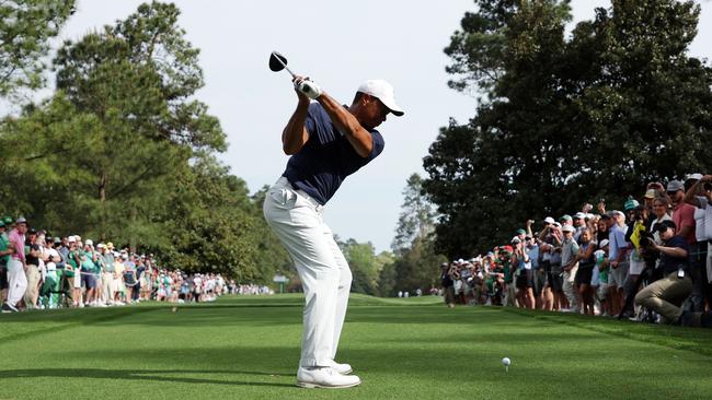 Tiger Woods of the United States plays his shot from the ninth tee