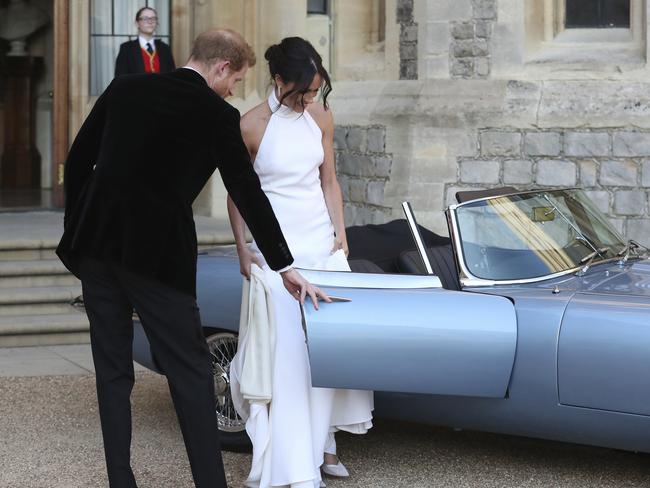 Prince Harry drove them in an E-type Jaguar. Picture: Steve Parsons/PA via AP.