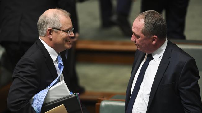 Prime Minister Scott Morrison speaks to government drought envoy Barnaby Joyce during  Question Time.