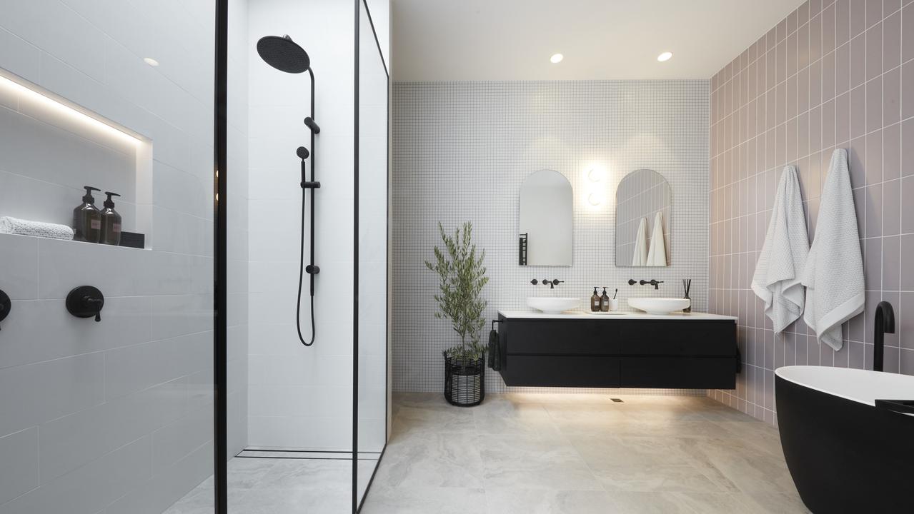 A luxurious matte black bathtub featured in the master ensuite.