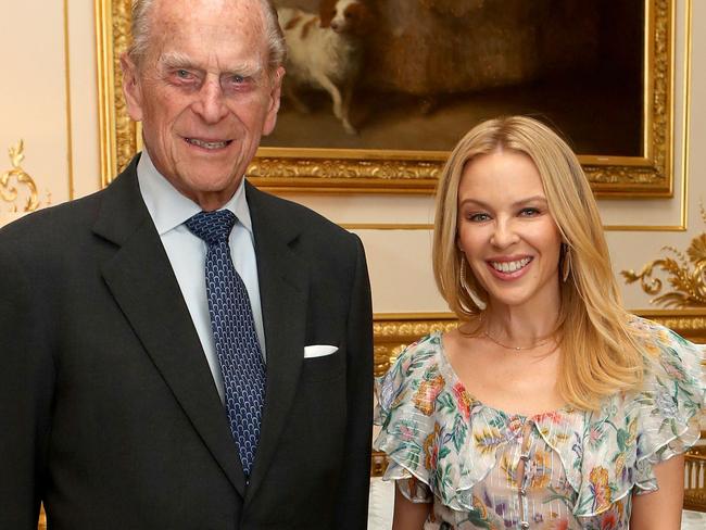 FILE- May 4:  Prince Philip, Duke of Edinburgh is to retire from public duties in the Autumn WINDSOR, UNITED KINGDOM - APRIL 04: Prince Philip, Duke of Edinburgh, Patron of the Britain-Australia Society, presents Kylie Minogue with the Britain-Australia Society Award for 2016 during a private audience in the White Drawing Room at Windsor Castle on April 4, 2017 in Windsor, United Kingdom.. The Britain-Australia Award recognises Australian and British individuals who have made a significant contribution to the Australia-UK bilateral relationship. Past recipients include Barry Humphries, and the Rt Hon Lord Hague PC.  (Photo by Steve Parsons - WPA Pool/Getty Images)