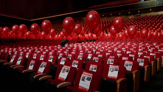 An installation consisting of balloons and pictures of Israeli hostages abducted by Palestinian militants at the Jerusalem Convention Centre. Picture: AFP