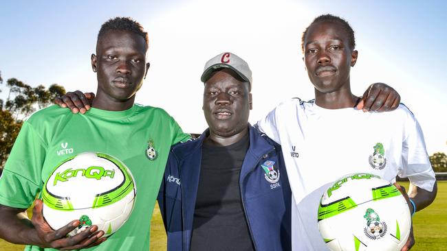 Nile United players Awal Dut and Jok Akuien with coach Arok Akoi Arok at Kalara Reserve in Davoren Park. Picture: Brenton Edwards