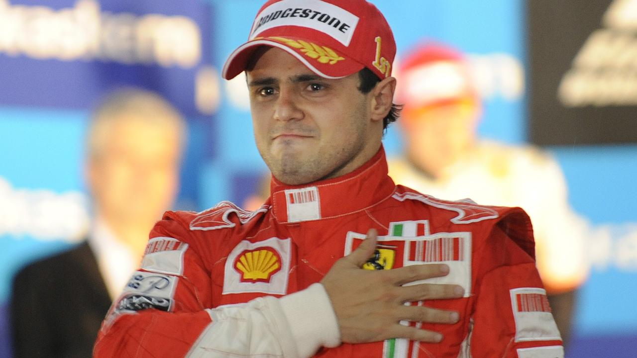 Ferrari Formula One driver Felipe Massa of Brazil fights back tears after he won the race but failed to secure the 2008 Formula One drivers championship in the Brazilian Formula One Grand Prix at the Interlagos circuit in Sao Paulo, Nov. 2, 2008. McLaren Mercedes Formula One driver Lewis Hamilton of Britain finished fifth and won the 2008 championship title. (AP Photo/Oliver Multhaup)