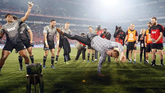 Crusaders coach Scott Robertson celebrates after their eight-point victory in the Super Rugby final.