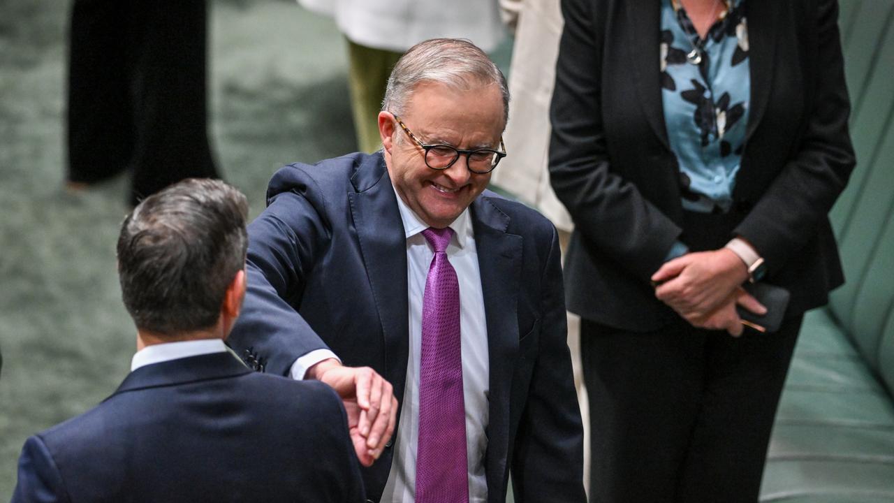 Treasurer Jim Chalmers (L) receives a pat on the back from Prime Minister Anthony Albanese before Chalmers delivers his budget speech at Parliament House on May 14, 2024 in Canberra, Australia. Photo by Tracey Nearmy/Getty Images.