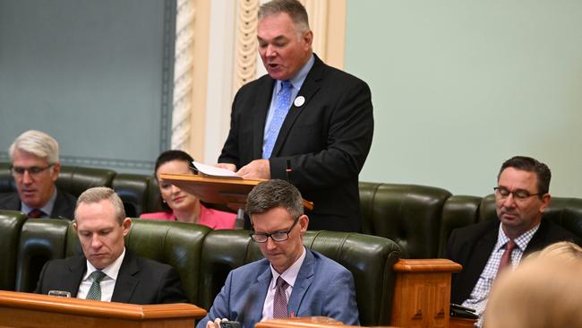 Pollies looking at their phones during parliament.