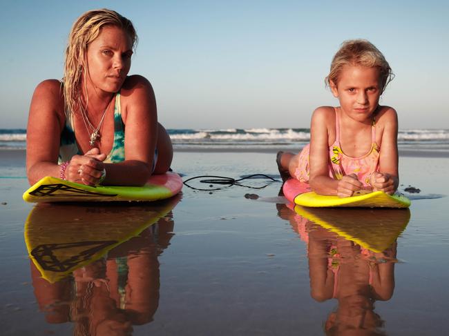 Kirsty Zoric, pictured with her six-year-old daughter Leihani who also surfs, has been a victim of rage on the waves. Picture: Danielle Smith