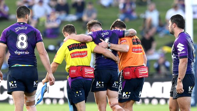 SUNSHINE COAST, AUSTRALIA - AUGUST 08: Cameron Munster of the Storm is injured during the round 13 NRL match between the Melbourne Storm and the Canterbury Bulldogs at Sunshine Coast Stadium on August 08, 2020 in Sunshine Coast, Australia. (Photo by Bradley Kanaris/Getty Images)