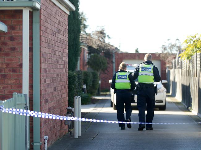 Police at the scene of the murder. Picture: Alison Wynd