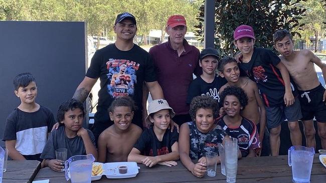 South Sydney coach Wayne Bennett (centre) visits Taree with Rabbitohs local hero Latrell Mitchell to meet some local kids.