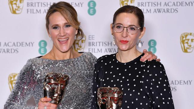 Production designer Fiona Crombie, right, and set decorator Alice Felton pose with their awards for Production Design at the BAFTA awards. Picture: AFP