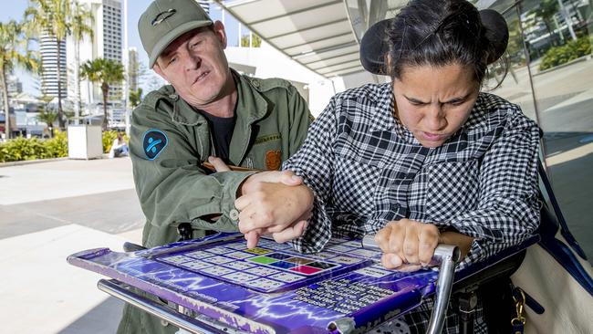 Marlena Katene has been forced to take to the street to get the attention of the non Verbal disability board ISAAC2018 at the Gold Coast Convention Centre in Broadbeach. Marlena Katene with her facilitator Bert Hibbert. Picture: Jerad Williams