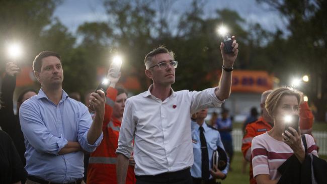 Premier Dominic Perrottet marking a one-minute silence at the reflection and healing service at Mortimer Oval. Picture: NCA NewsWire / Natalie Grono