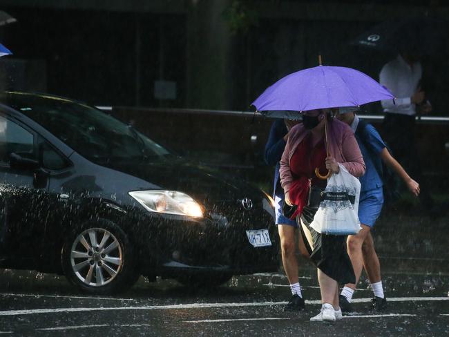 It was even tough trying to cross the road in Sydney’s big wet. Picture: NCA NewsWire/ Gaye Gerard